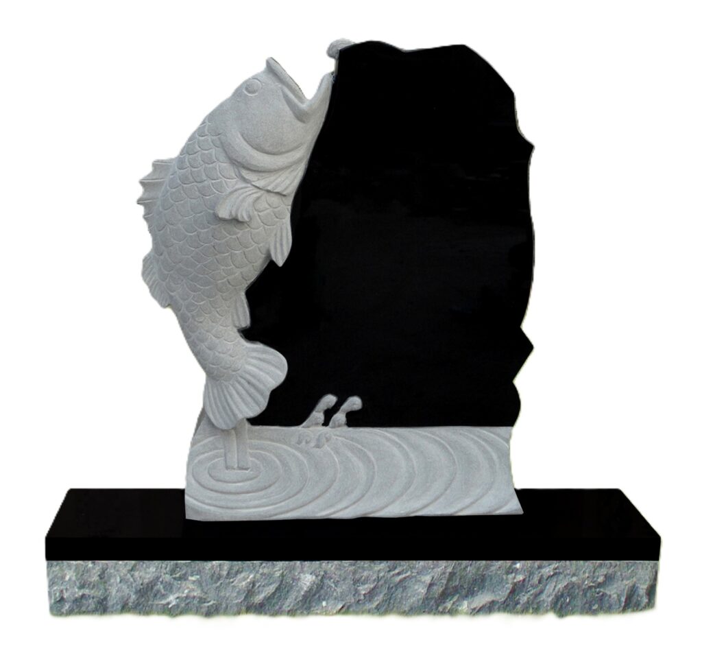 Fish Headstone Carved stone sculpture of a leaping fish against a smooth black backdrop, mounted on a textured base. Symbolizes vitality and achievement.