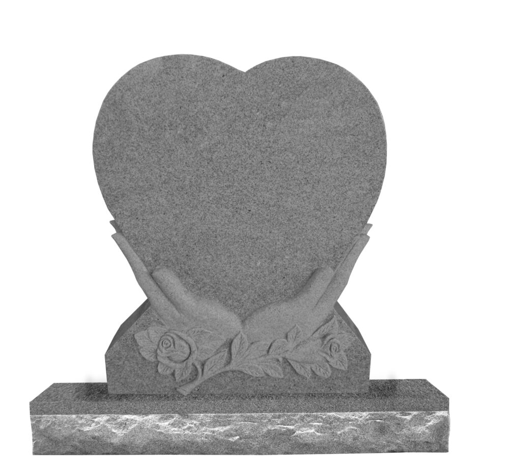 Heart In Hands Granite gravestone shaped like a heart, supported by carved hands and adorned with roses, symbolizing love and remembrance.