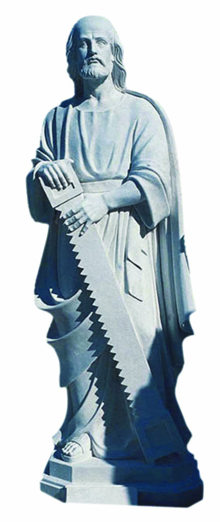 St. Joseph the Carpenter A sculpted figure of a man holding a large saw, dressed in flowing robes, symbolizing craftsmanship or carpentry, often associated with builders.