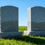 Two companion headstones in a cemetery.